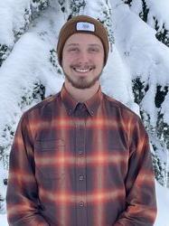 Young man in front of snow